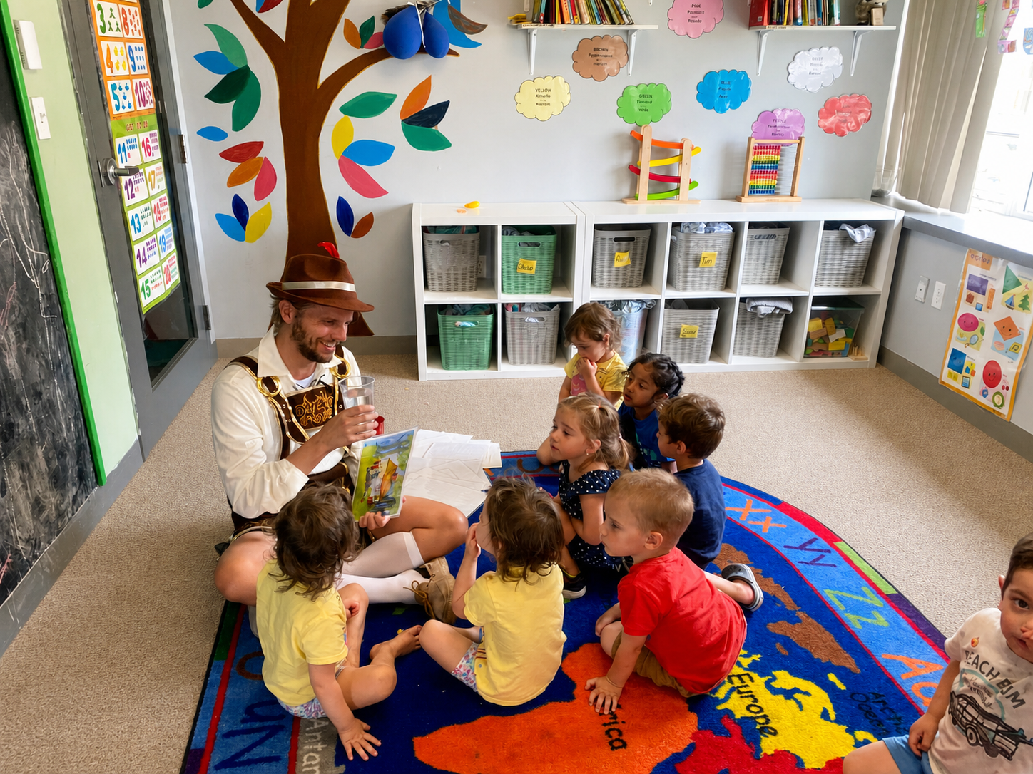 Children gathered around a visiting storyteller in cultural clothing